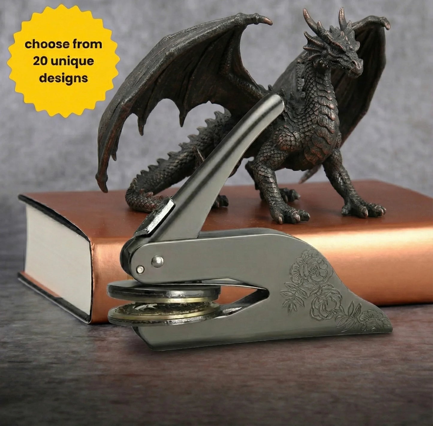Mythology themed custom book embosser featuring a dragon and vintage books.